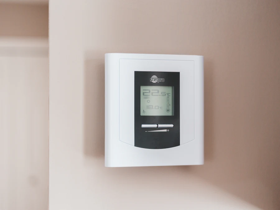 Wall-mounted digital heating thermostat set to 19.5 degrees